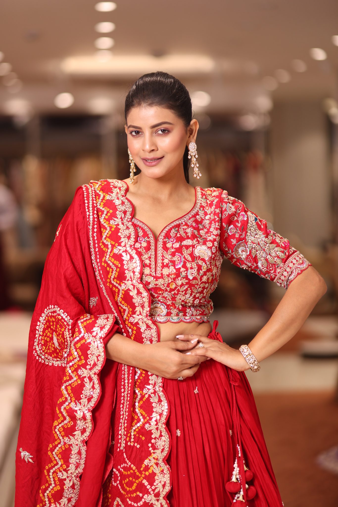 Sindoori Red Silk Bridal Lehenga Set with Intricate Floral Gota Patti and Hand-Embroidered Bandhani Dupatta